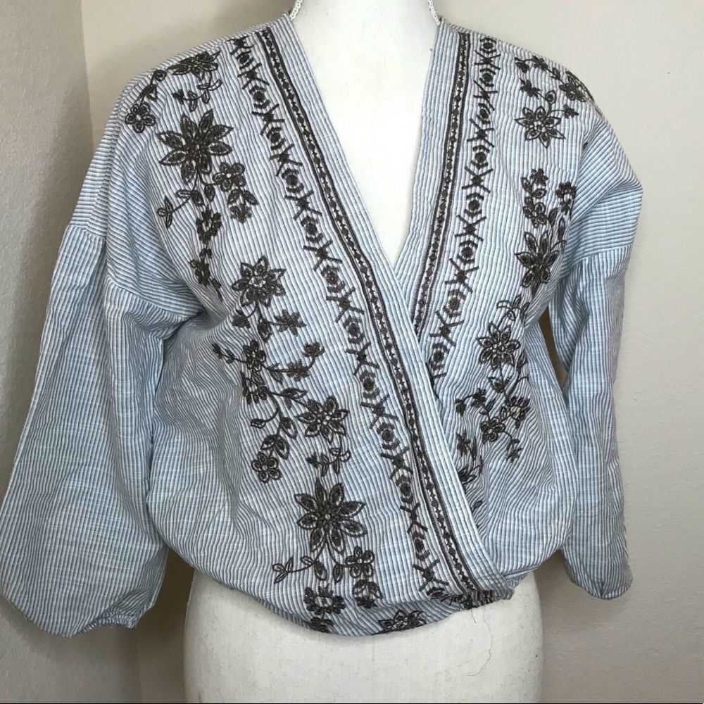 Cropped striped surplice wrap blouse